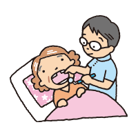 ベッドで治療する歯科医師