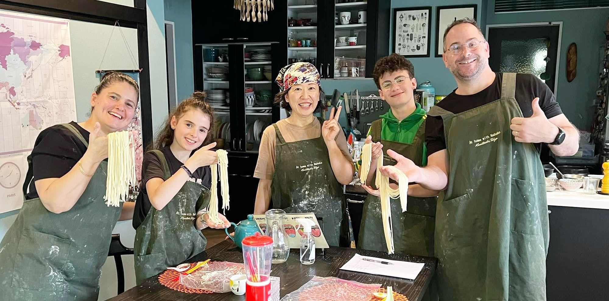 Nahoko teaching a Japanese cooking class in her home kitchen