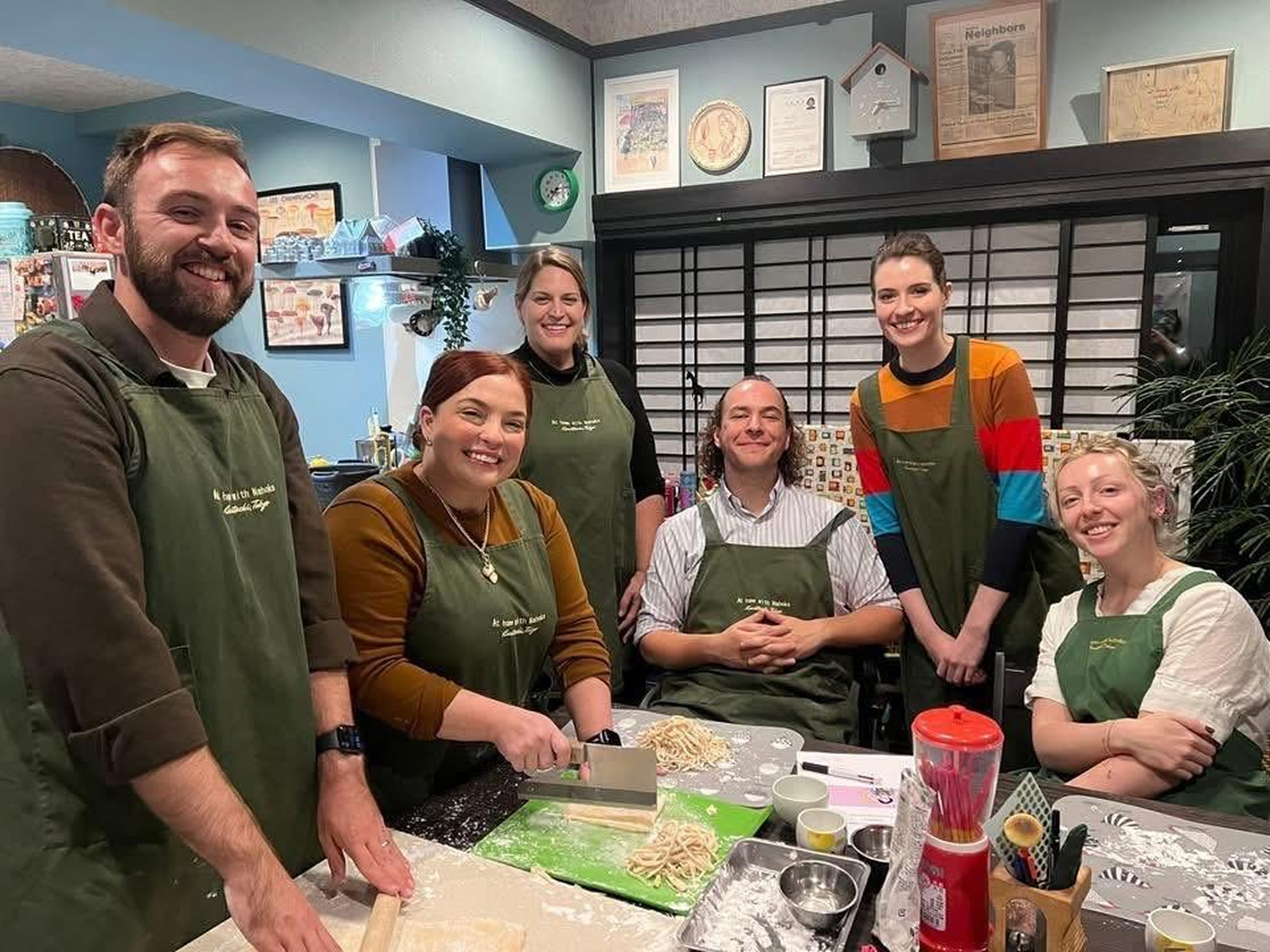 Guests enjoying cultural exchange and conversation beyond cooking at Nahoko's class