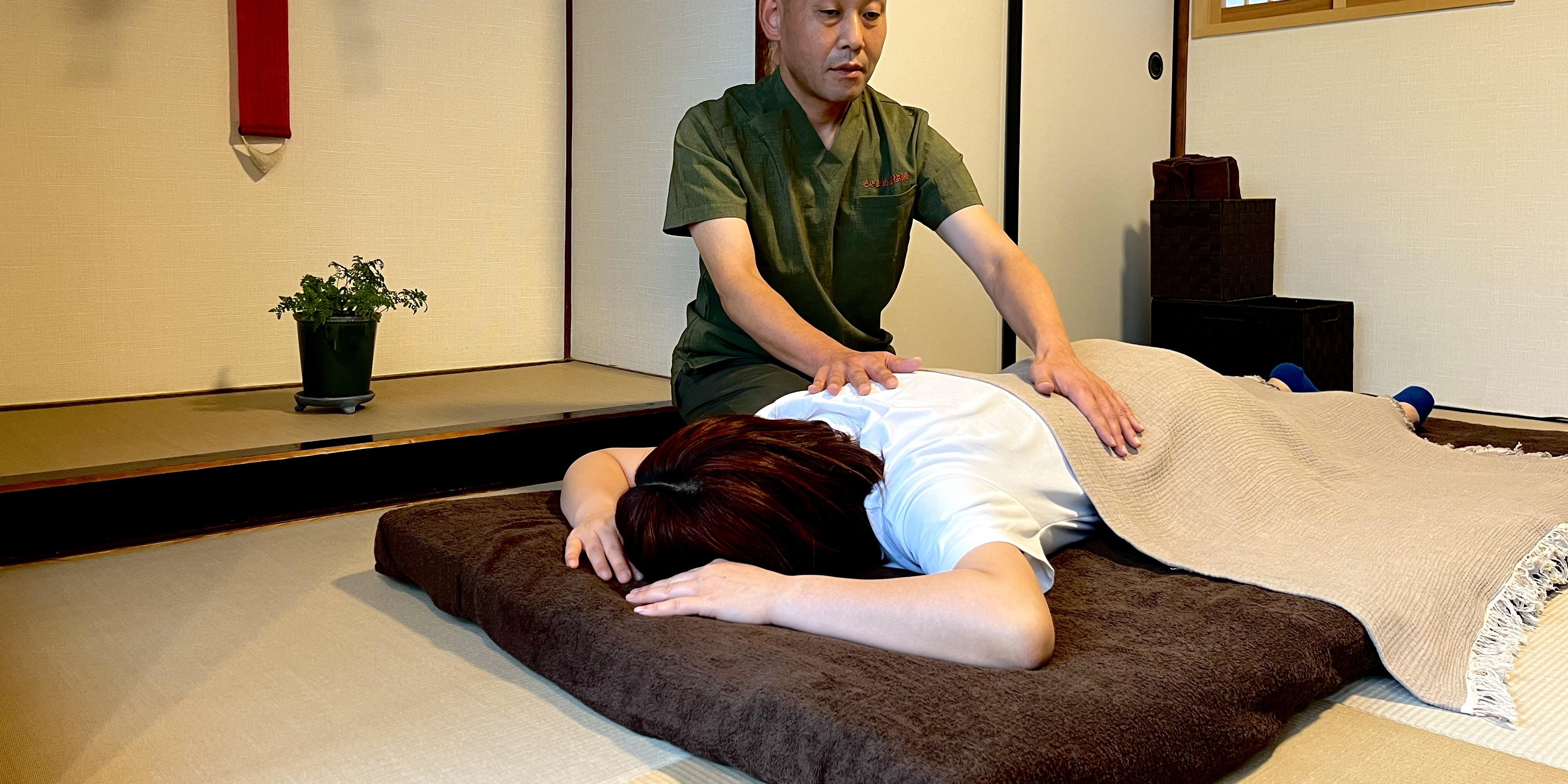 Usui Reiki healing session on tatami mat in a traditional Japanese room in Takarazuka Japan.