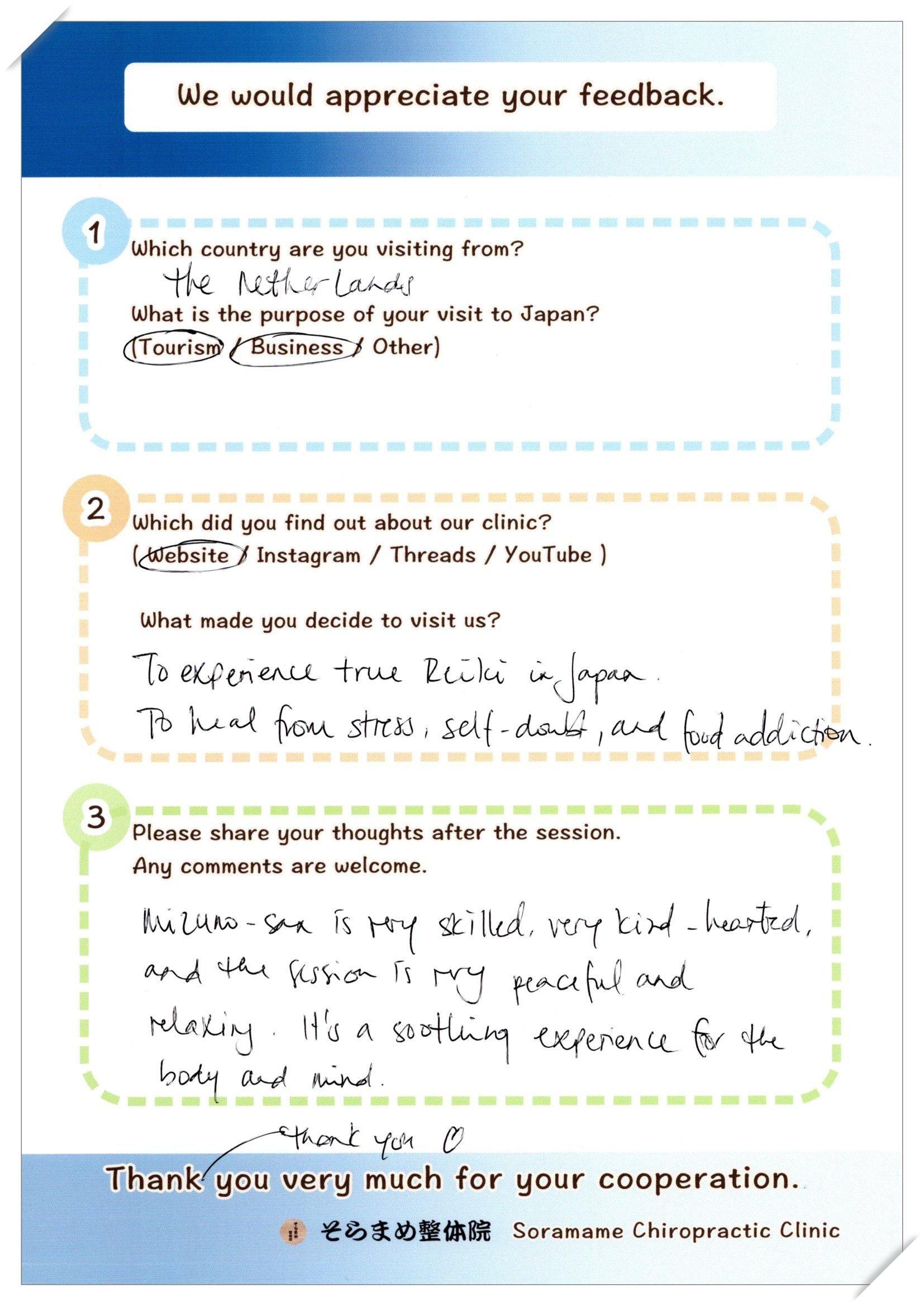 Handwritten feedback form from a guest from the Netherlands, describing her peaceful and relaxing Reiki experience.