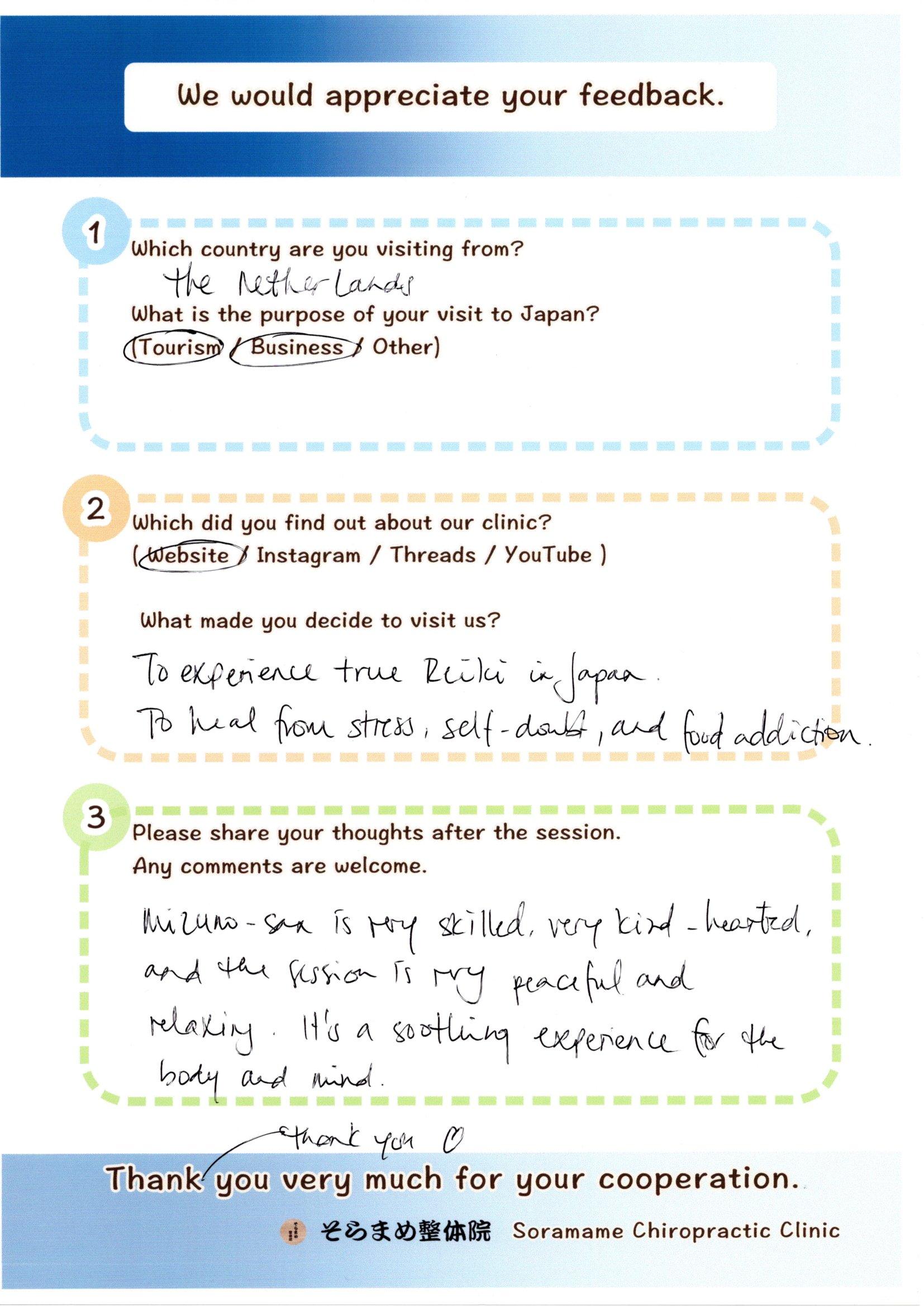 Handwritten feedback form from a Dutch guest, describing her peaceful and relaxing Reiki experience.